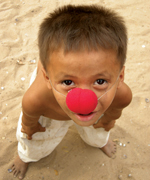 Little clown boy in the slum